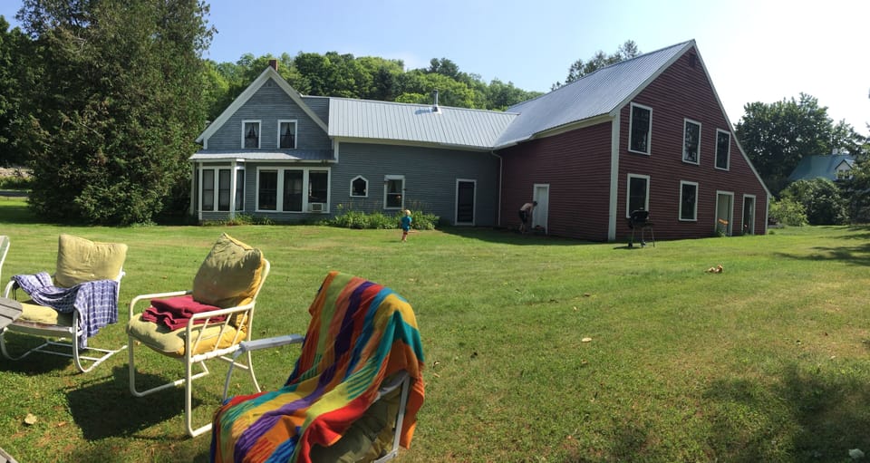 Back yard cushion lawn chairs overlooking the lake