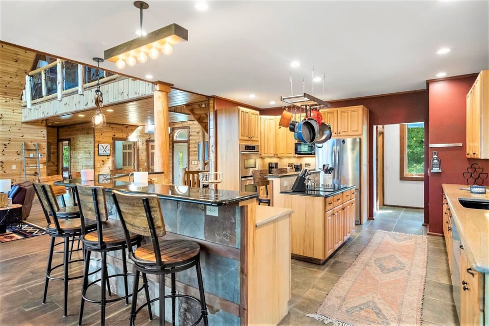 Huge open concept kitchen with lots of counter space for big meals for the group