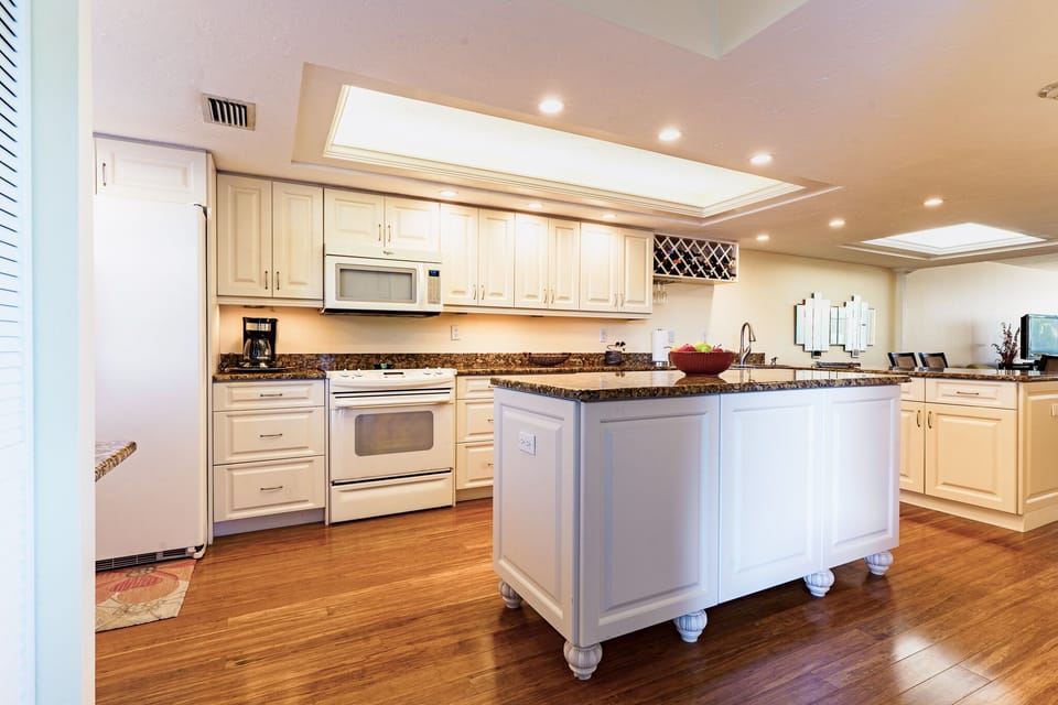 The kitchen includes a large island allowing for multiple people to be together cooking