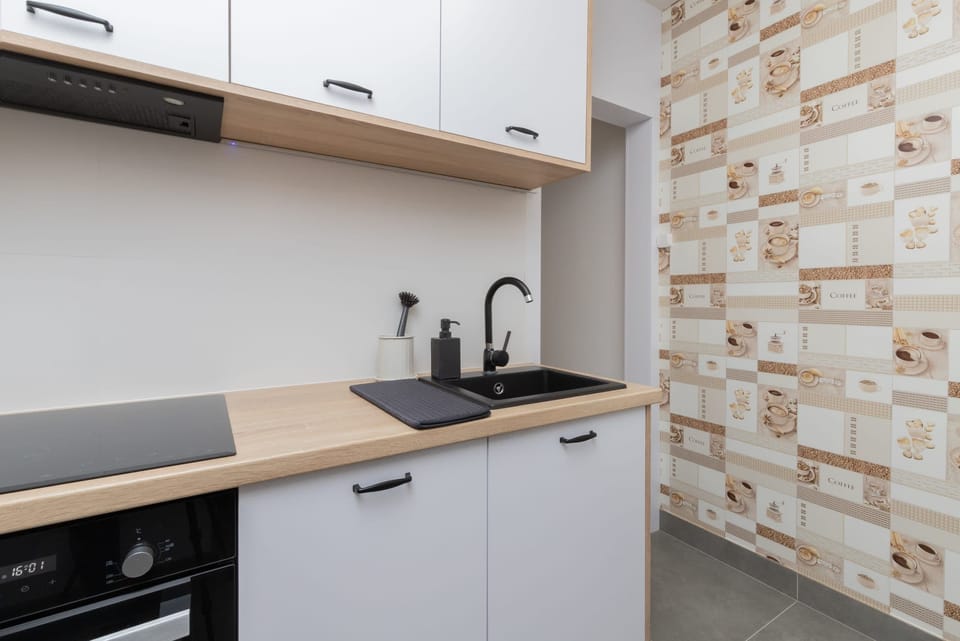 A wider view of the kitchen, showcasing the ample storage space.