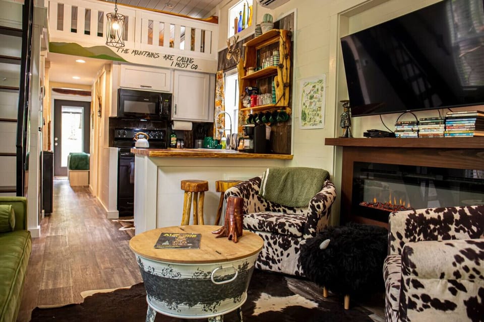 Bright and cozy living room stocked with games (monopoly, monopoly deal, Yahtzee, uno, and cards) and TV with lots of DVDs for all ages as well as free access to YouTube TV.