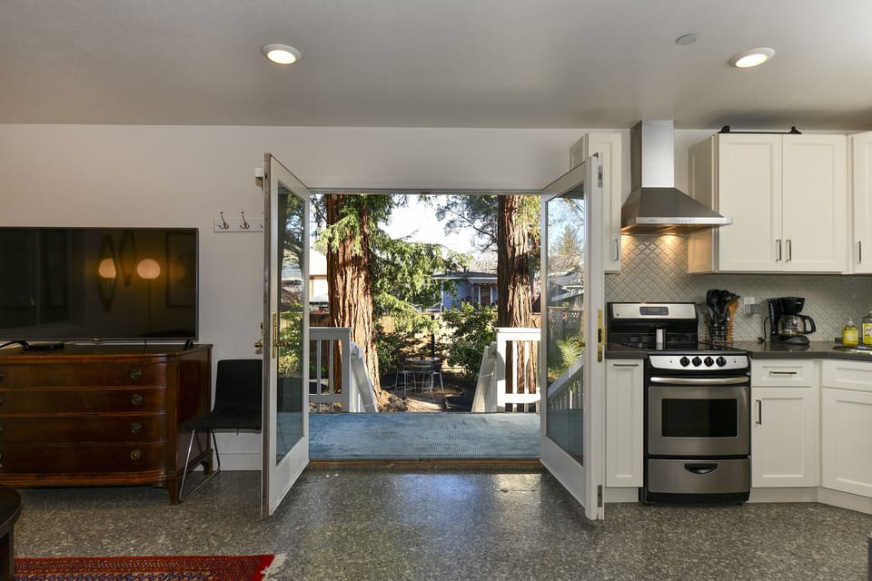 Open the French Doors and take in the fresh air and two giant redwoods!