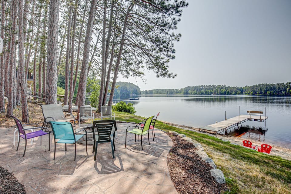 stamped concrete patio, stone fire pit, dock, sandy beach