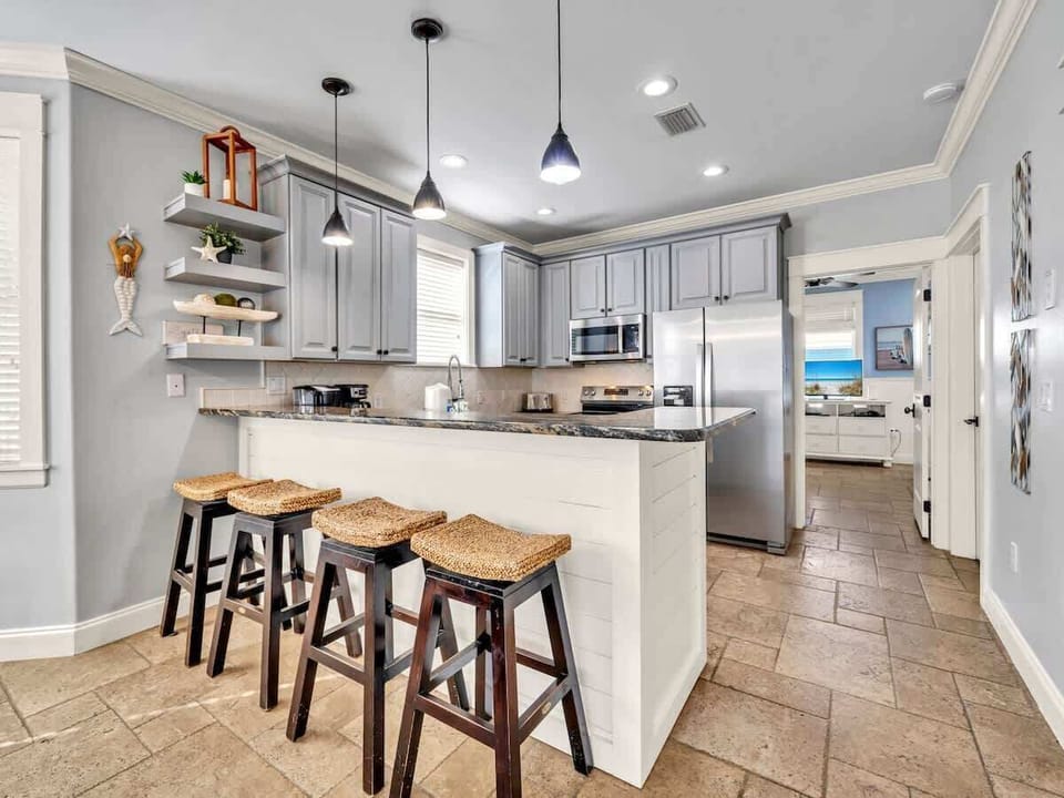 Enjoy Cooking a Great Meal in This Airy Kitchen, Stainless Appliances, Stocked With  A Keurig and A Standard Coffee Pot Too.