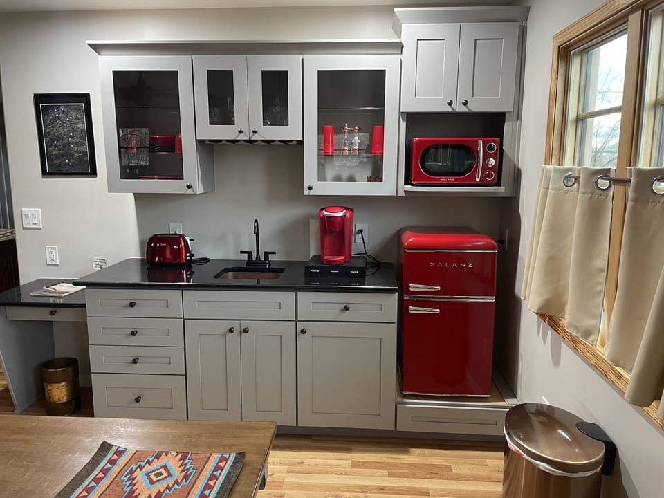 Retro Mini Fridge, microwave, toaster, copper sink, granite countertop, desktop.