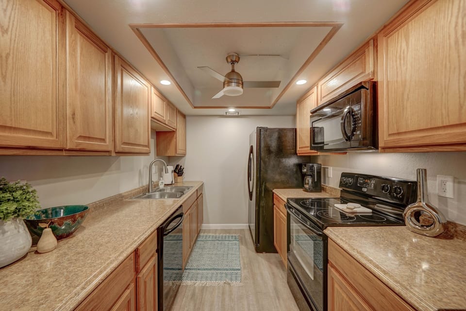 Galley style kitchen is fully stocked