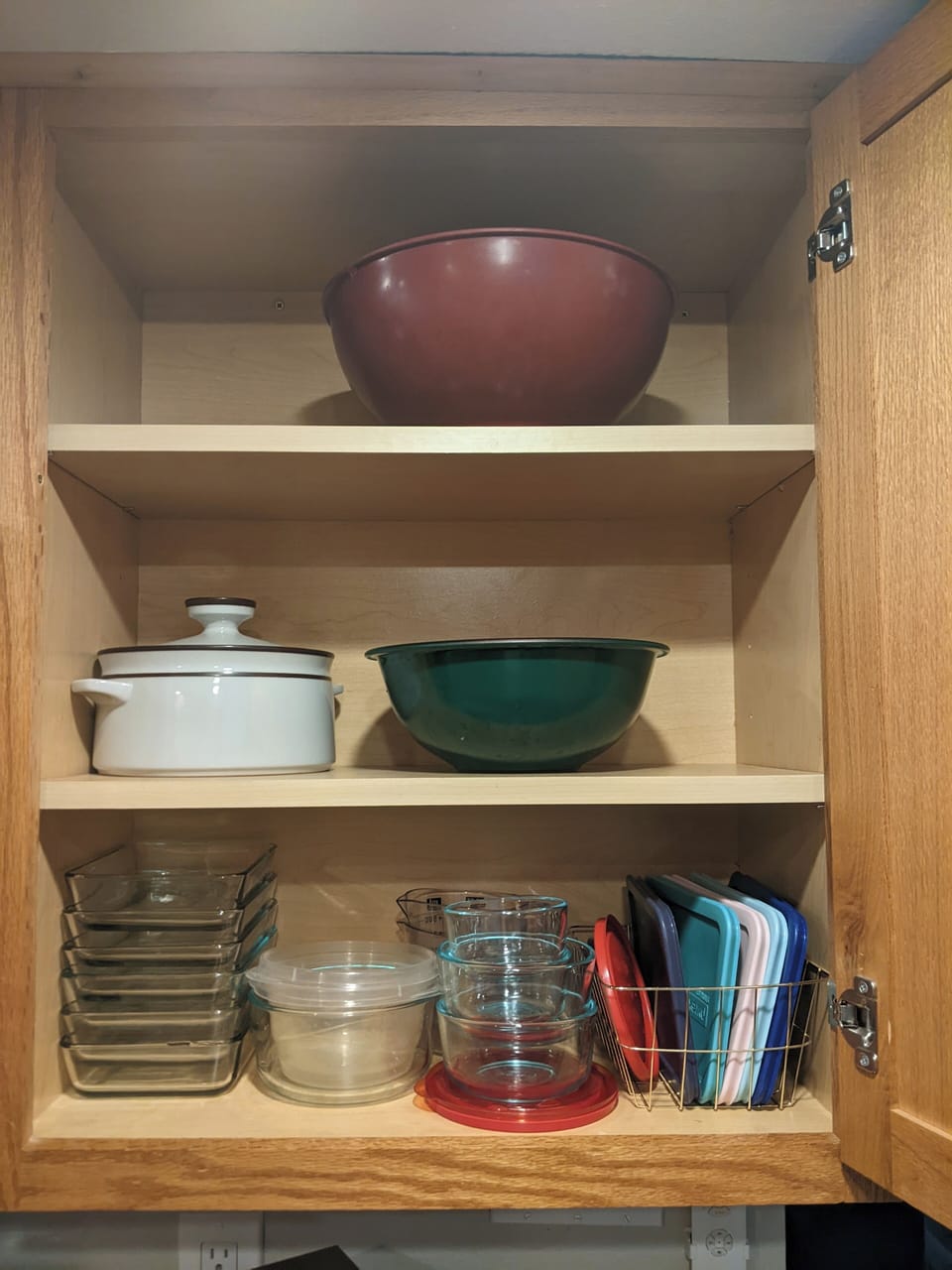 Fully stocked kitchen with pyrex dishes and mixing bowls