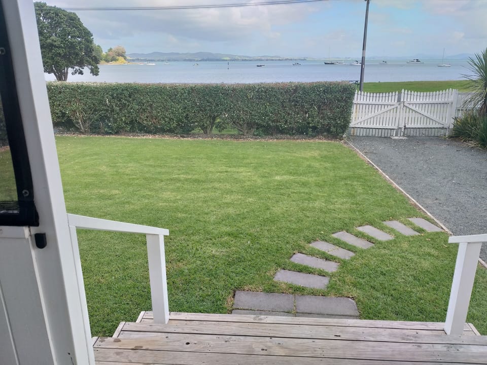 Relax on the on the front deck and enjoy the view or wander across to the beach