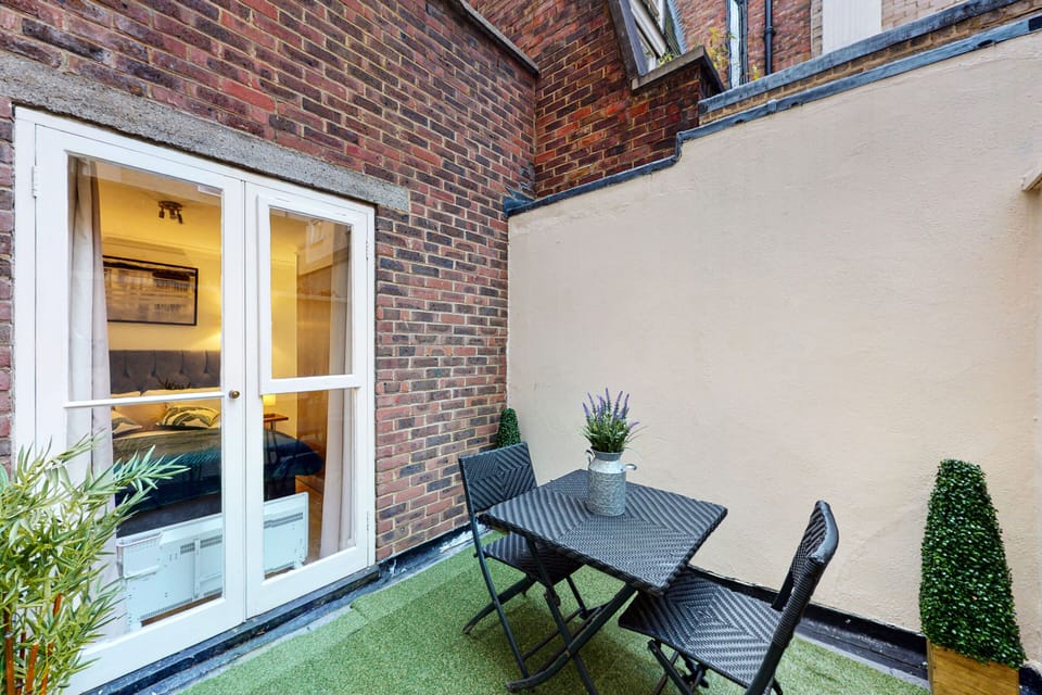 Private patio with table and chairs