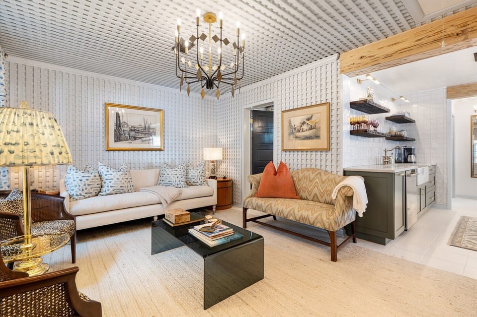 Designer lattice living room with wet bar open to the kitchen.