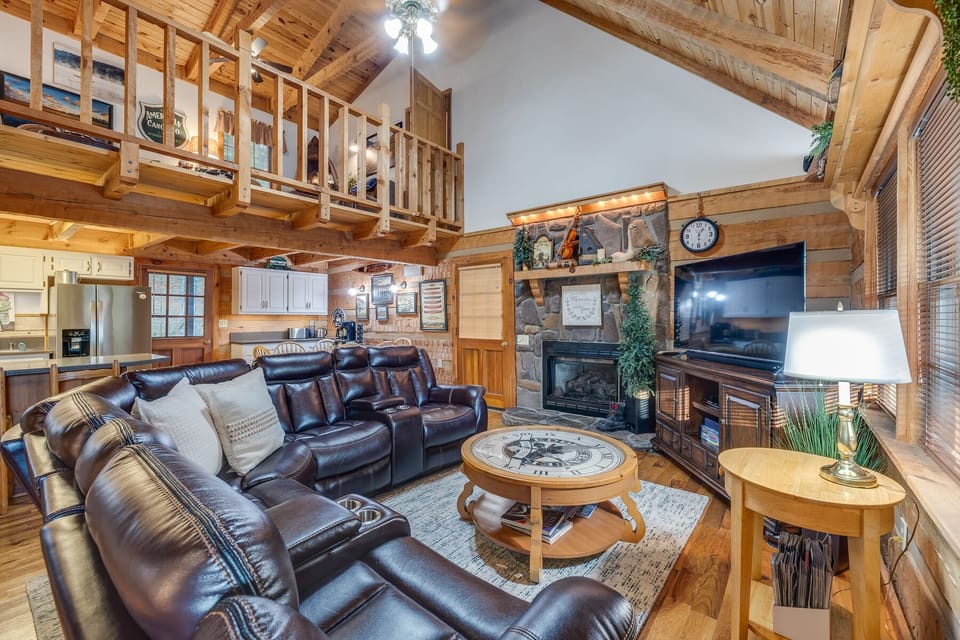 Another view of this gorgeous downstairs living area! Trust us; you'll have a hard time leaving that leather sofa!