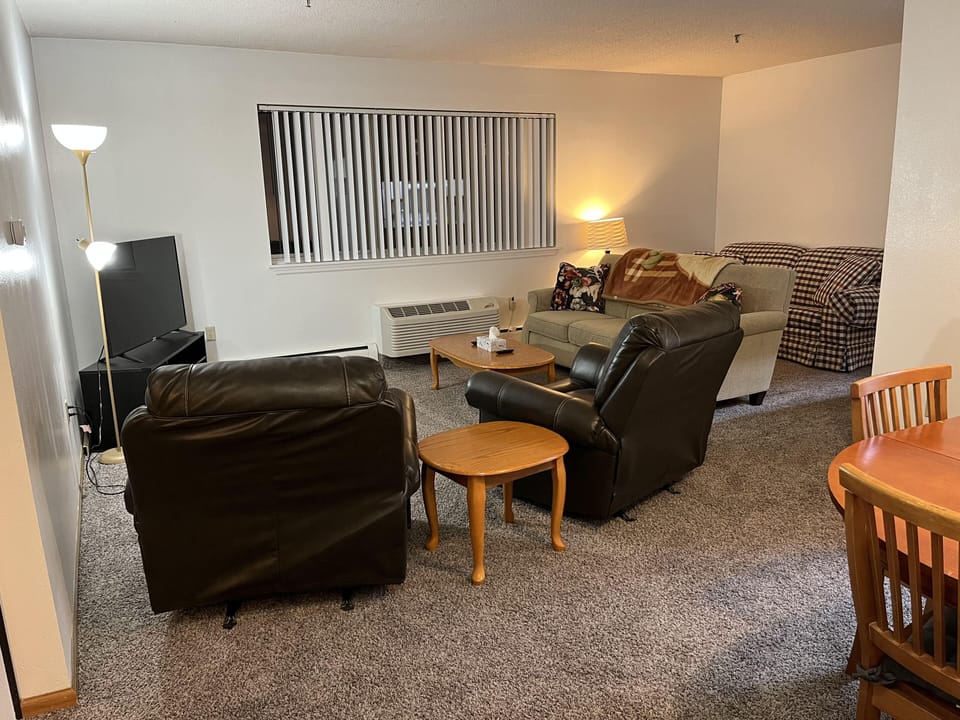 Living room with extra couch and two comfy chairs