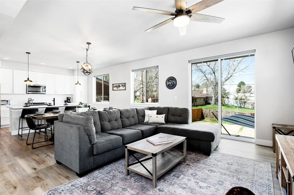 - Gather in this open concept living room with plush sectional and backyard views
