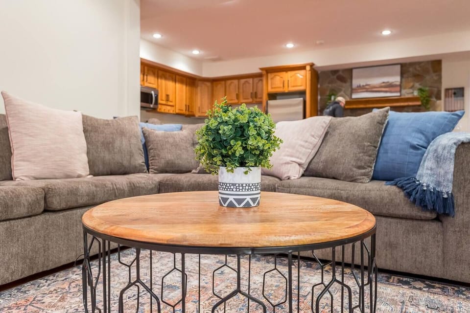 Oversized sectional sofa and overhead lighting.