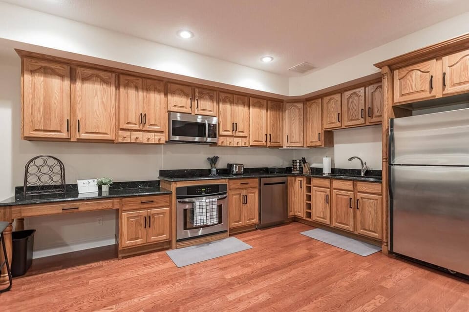 Abundance of cabinetry with cooktop, oven, microwave, dishwasher and refrigerator/freezer