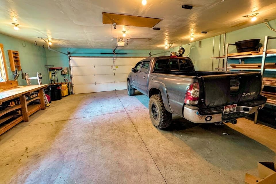 Keep your gear and your car dry using the available garage stall. (The owner stores his truck year-round on the other side.)