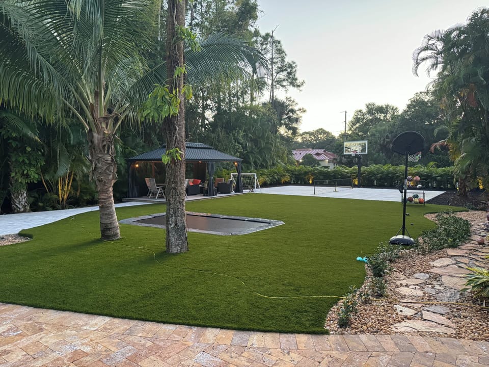 Basketball/Pickleball Court. In-ground Trampoline. Pergola and Fire Pit Area. 