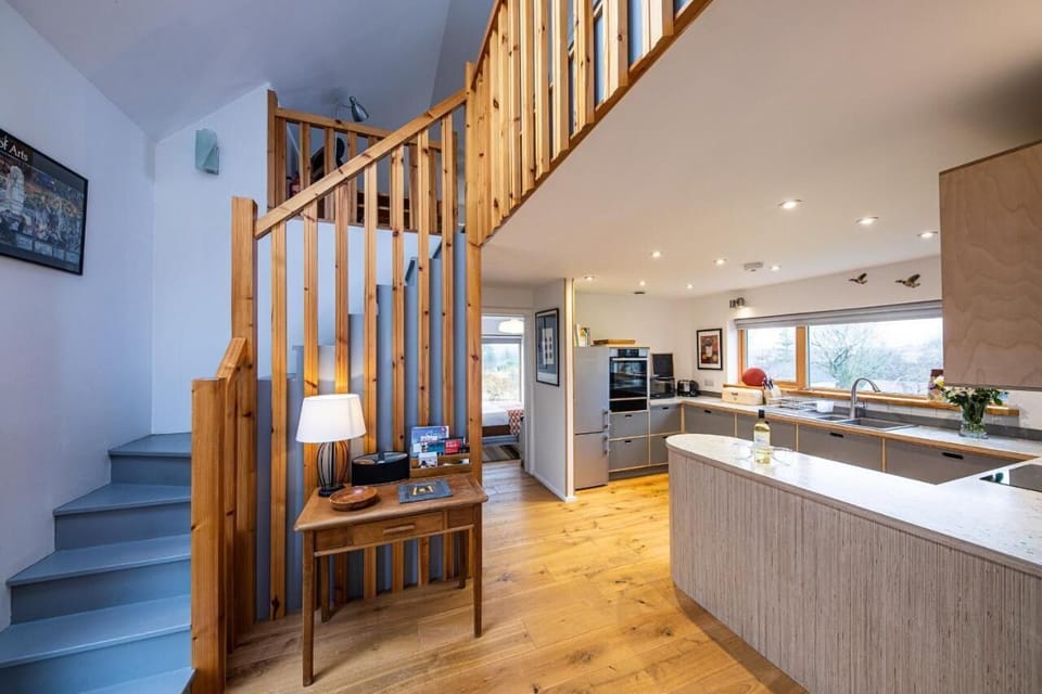 Hall/kitchen and staircase area. 