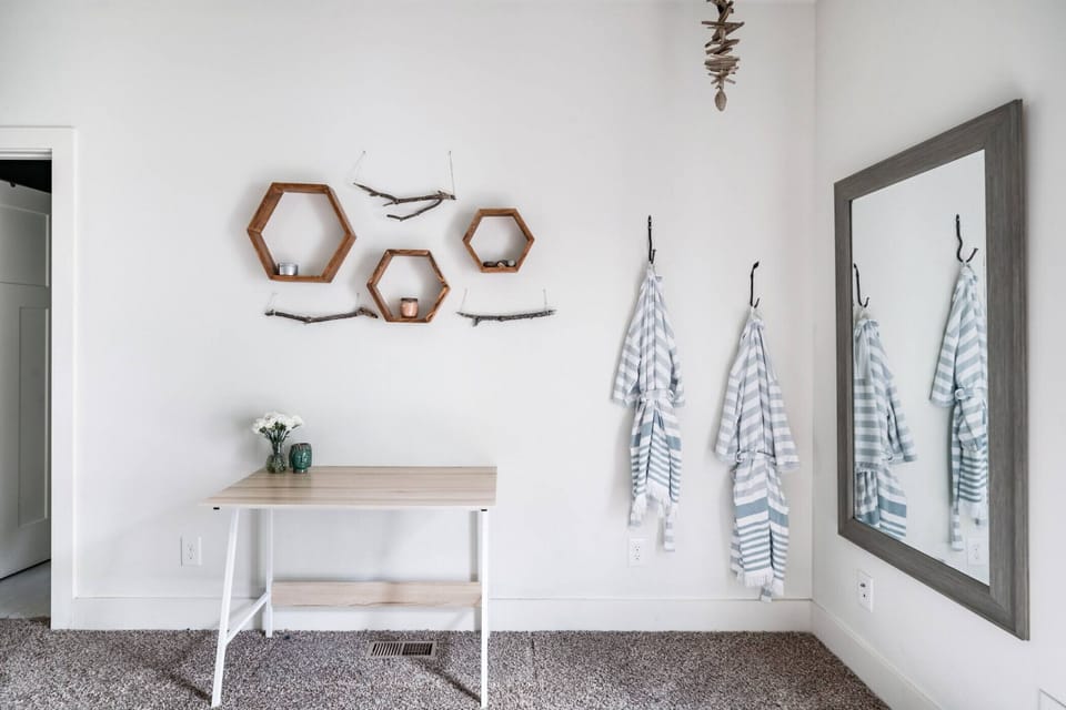 Cozy nook area with a full size mirror.