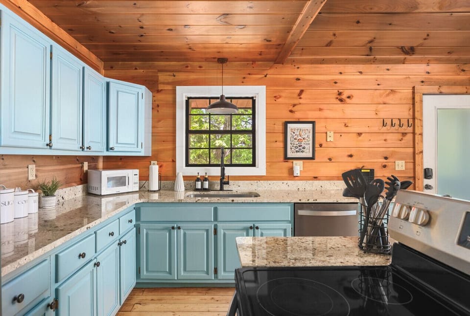 Fully-stocked kitchen with all the appliances & utensils you might need.