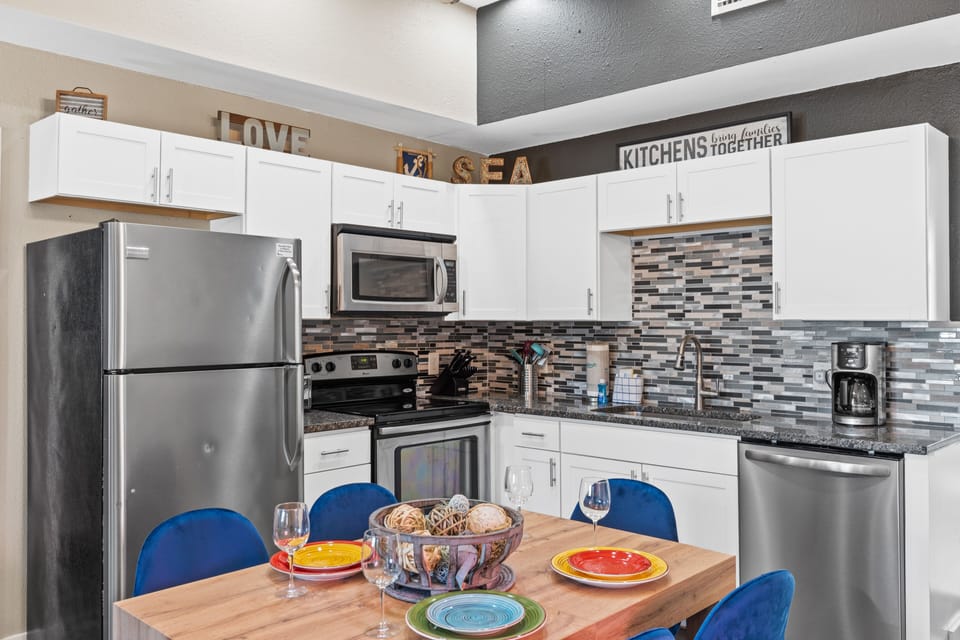 Fully Stocked Kitchen and Dining Area