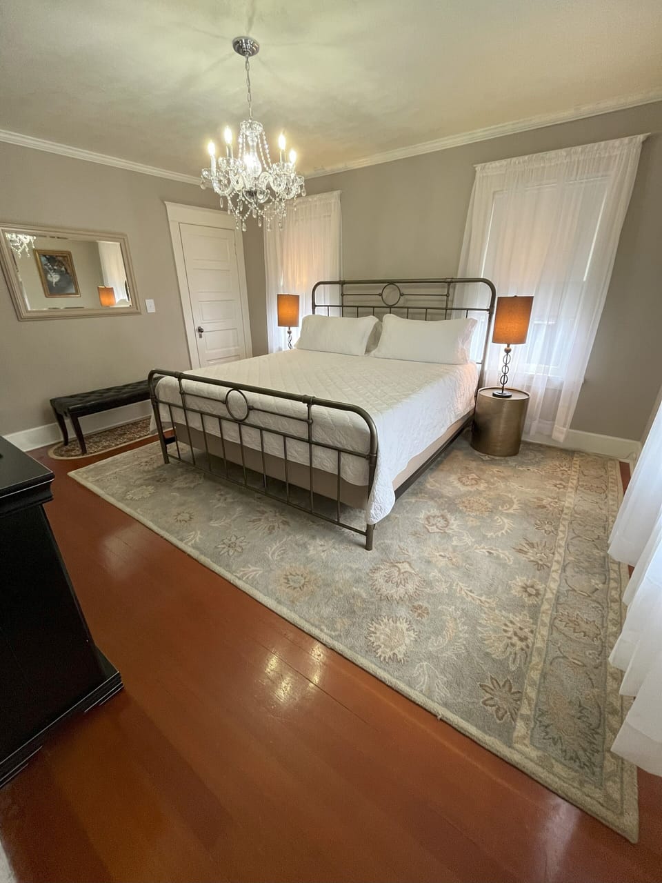 Primary bedroom with king bed and bathroom