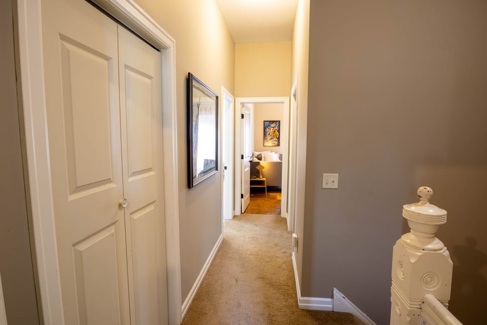 Upper hallway:  laundry to left, two guest bedrooms at hall's end