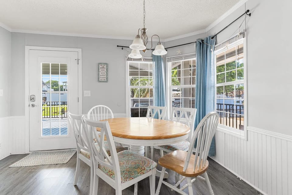 Cozy dining nook with bright garden views and natural light