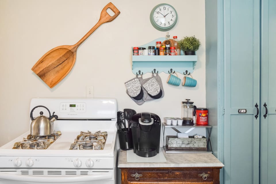 Gas stove/range and Keurig coffee maker.