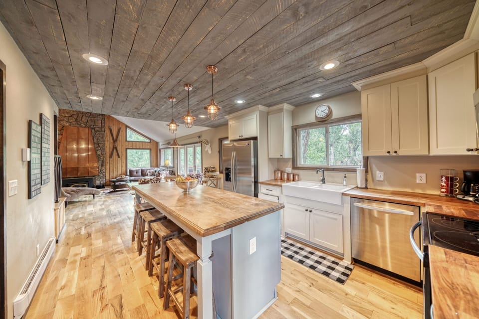 Fully-appointed kitchen with bar seating.