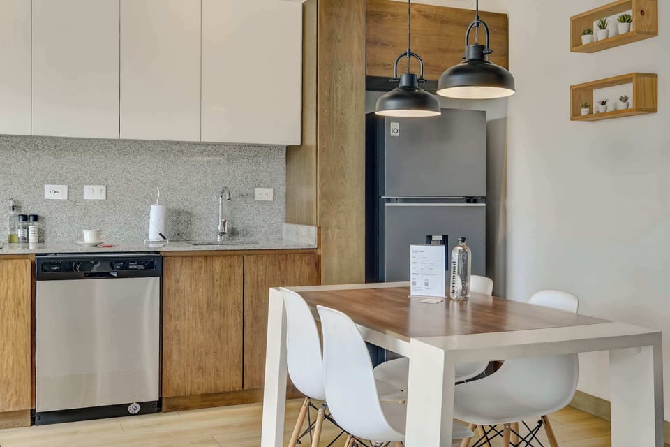 Fully equipped kitchen with a dining table, perfect for home-cooked meals.