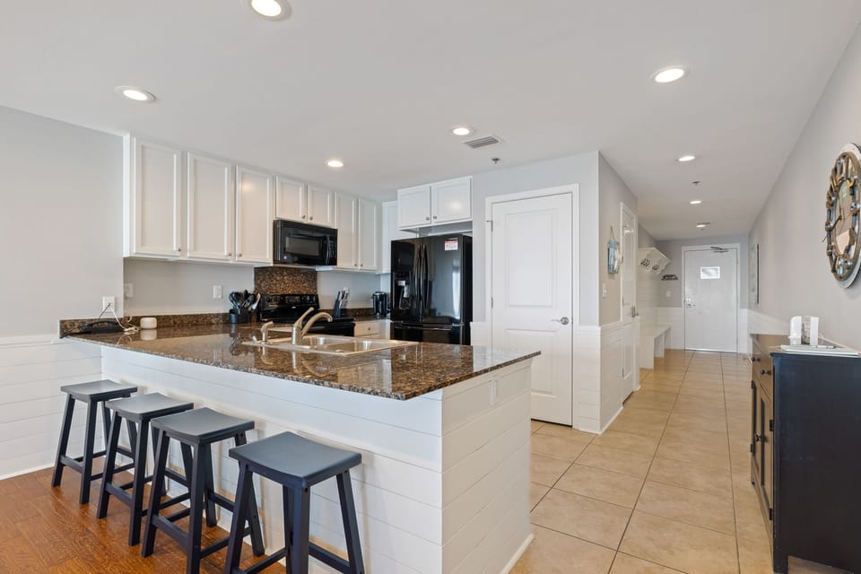The saddle stools at the breakfast bar provide additional seating and a great place to sit and talk with the cook.