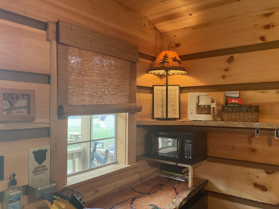 Table for two, microwave, coffee maker, and mini refrigerator 