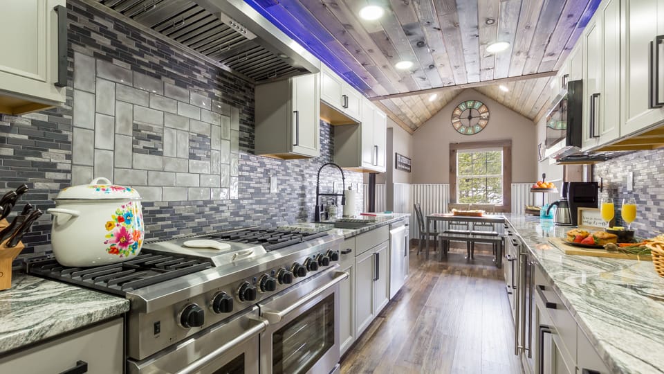 Even in the mountains, you can enjoy cooking top-notch meals in a gourmet kitchen.  Make memories and impress your guests with your cooking skills by utilizing this stunning kitchen setup.
