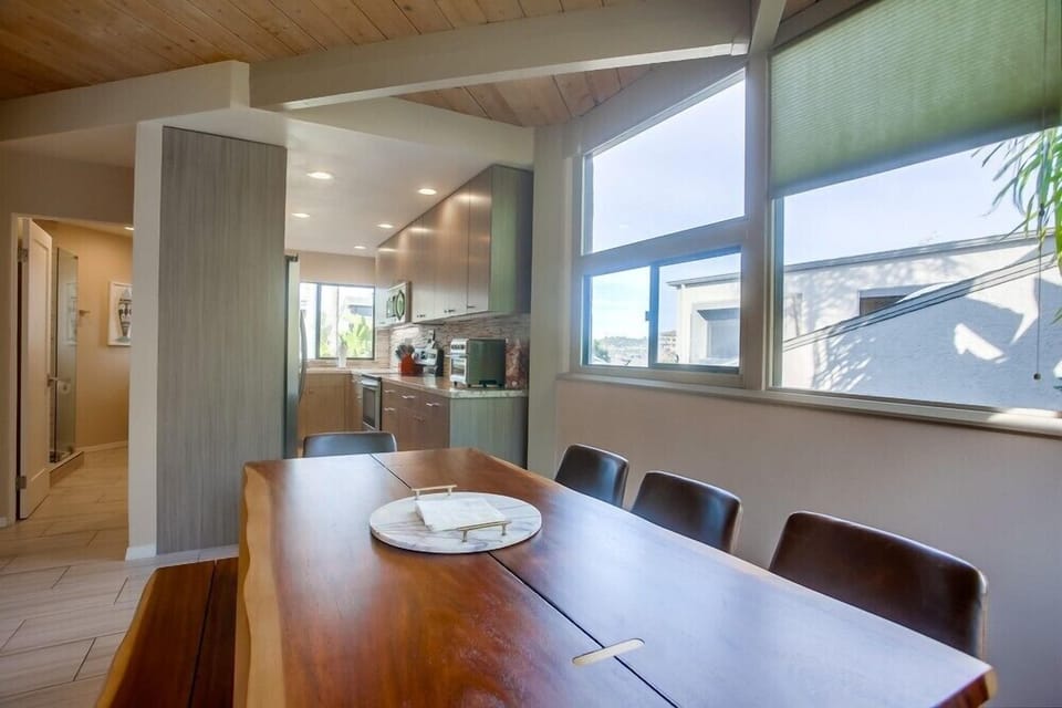 The dining area looks directly into the galley kitchen.