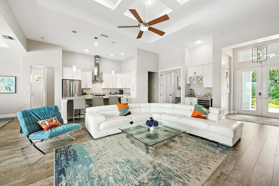 Living Room with Open Concept Floor Plan to Kitchen and Dining Space