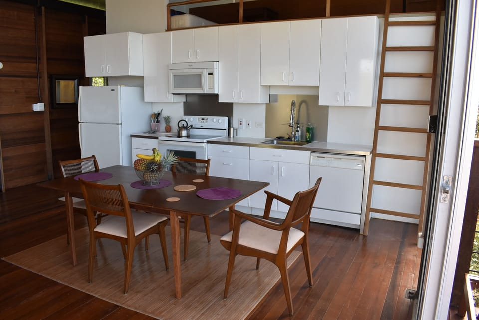dining room area in open floor plan with 12ft ceilings 