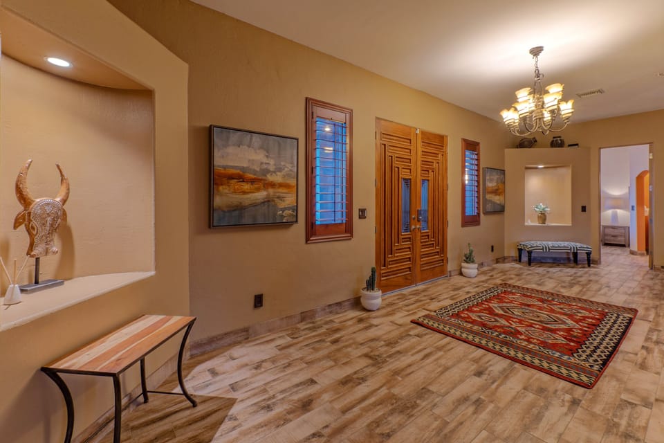 Front foyer splits the bedrooms and hints at what lies beyond in our well appointed home.