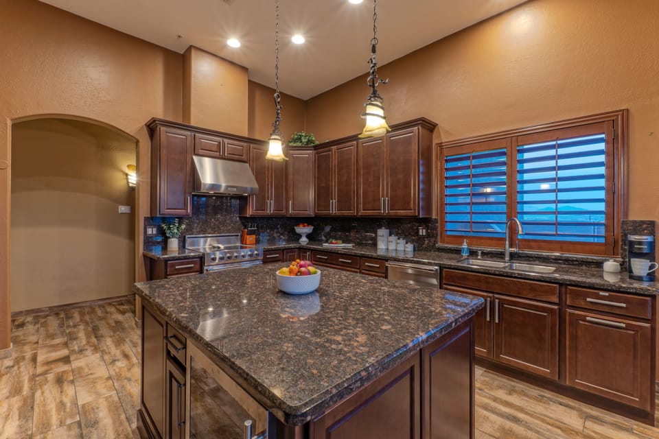 Modern kitchen with center island has generous counter space for serving a large feast.