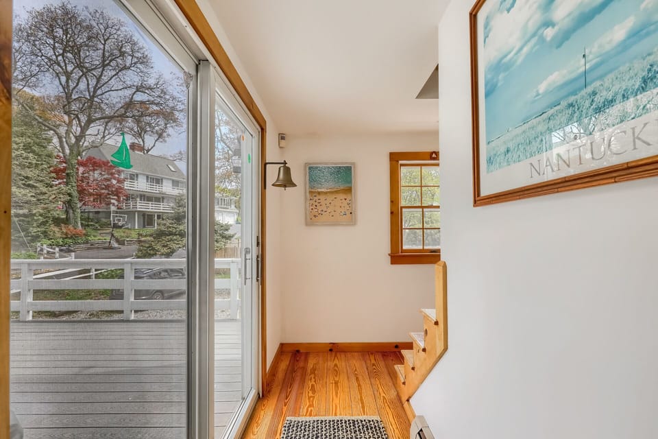 BACK STAIRCASE TO UPSTAIRS BEDROOMS, SLIDER TO LARGE DECK