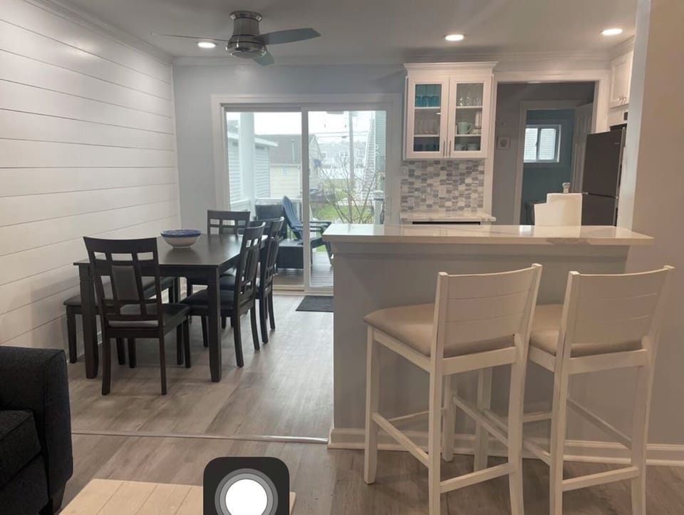 Open concept dining area seats 6 plus two bar stools. 