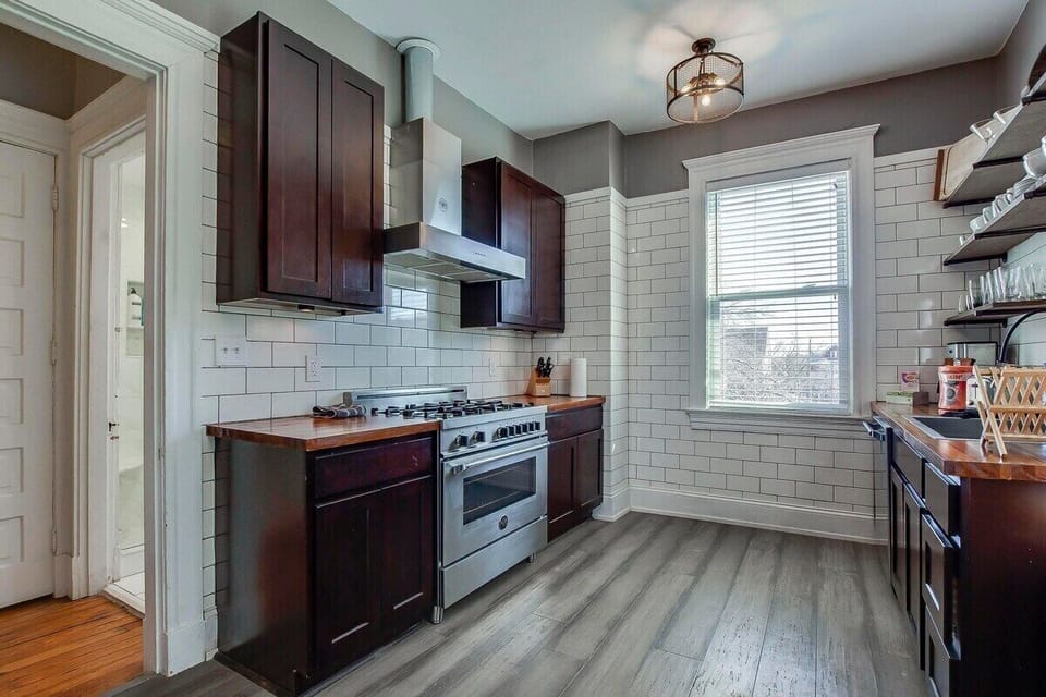 The massive historic Bonnycastle Villa is within walking distance of some of the area's best boutique shops and local restaurants.  Features 2 separate living spaces, 2 kitchens, huge dining bourbon tasting and game room, 6 Bedrooms, including 2 king beds!