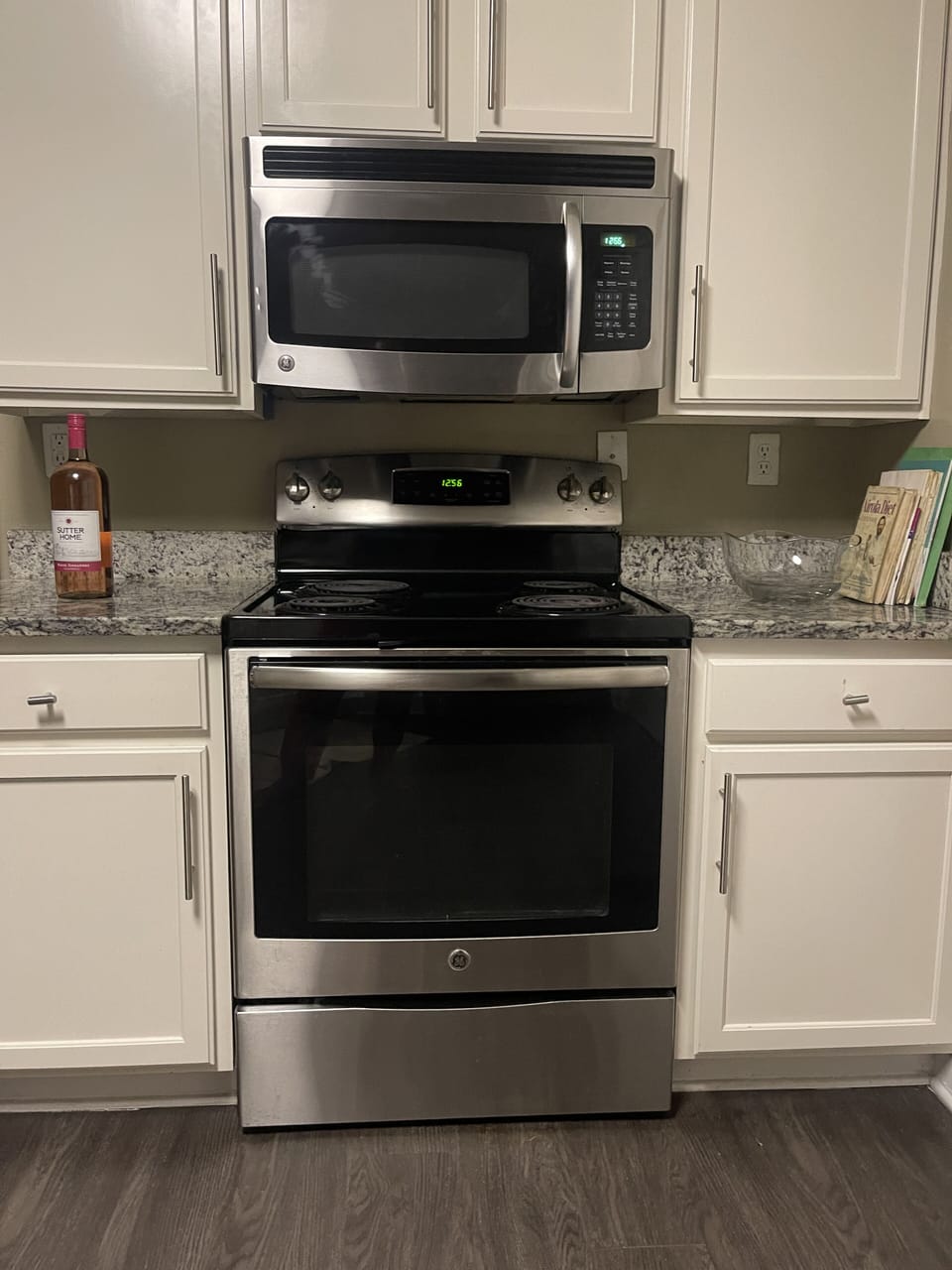 full kitchen with oven, stove and microwave