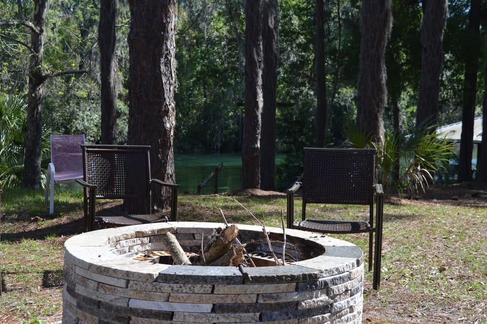 Enjoying the river day or night with warmth, hotdogs and s'mores!