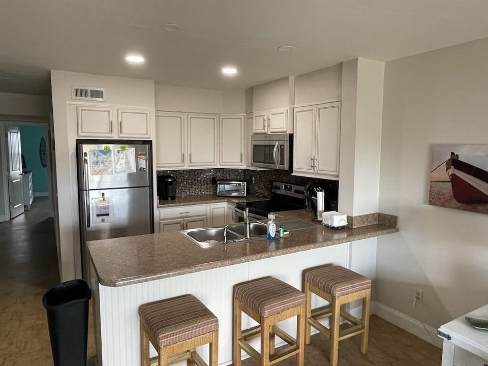 Remodeled kitchen.  We raised the ceiling for open feel and new lights.
