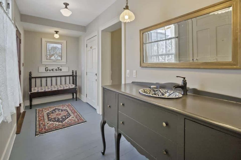 Back door entry room, with half bath and vanity