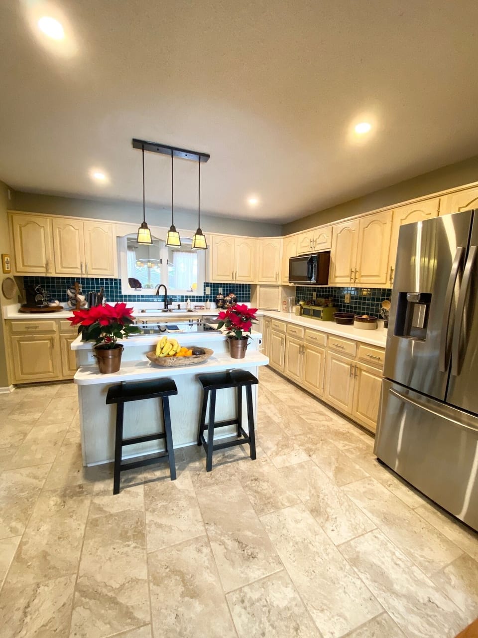 View from formal dining room into kitchen with breakfast bar