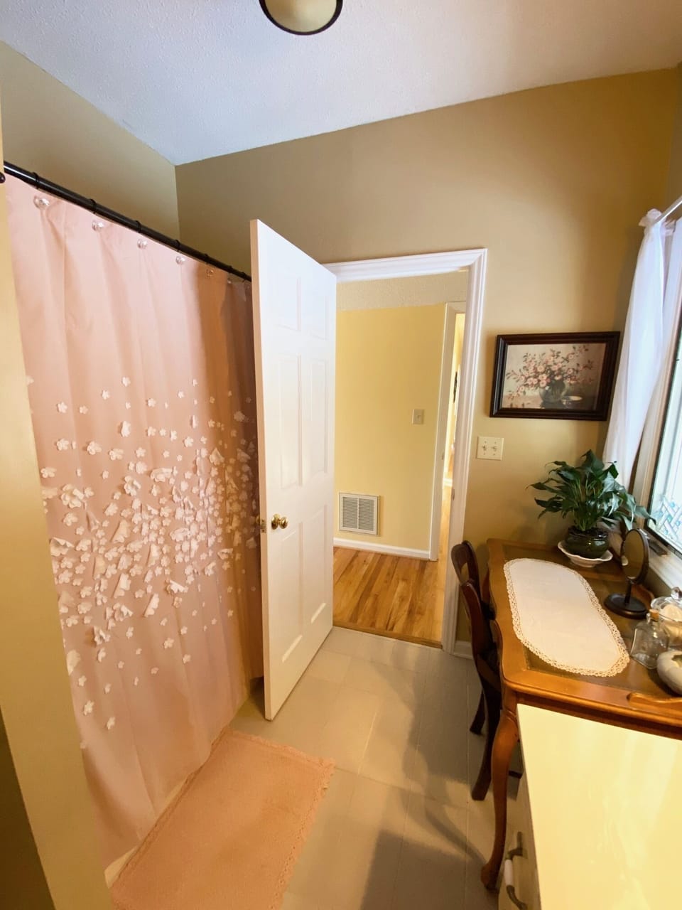 Upstairs full bathroom with makeup vanity and single vanity