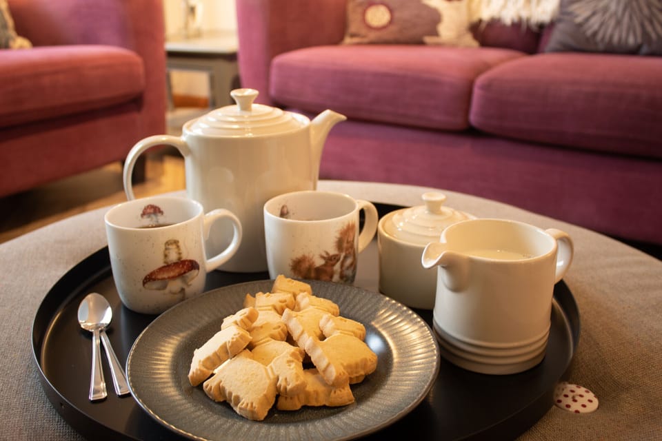 Relax with a cup of tea in the cosy living room 