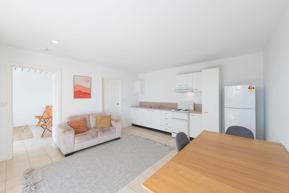 The downstairs apartment, bedroom, kitchenette and living area